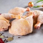 frozen-meat-chicken-legs-light-concrete-background-raw-216715917